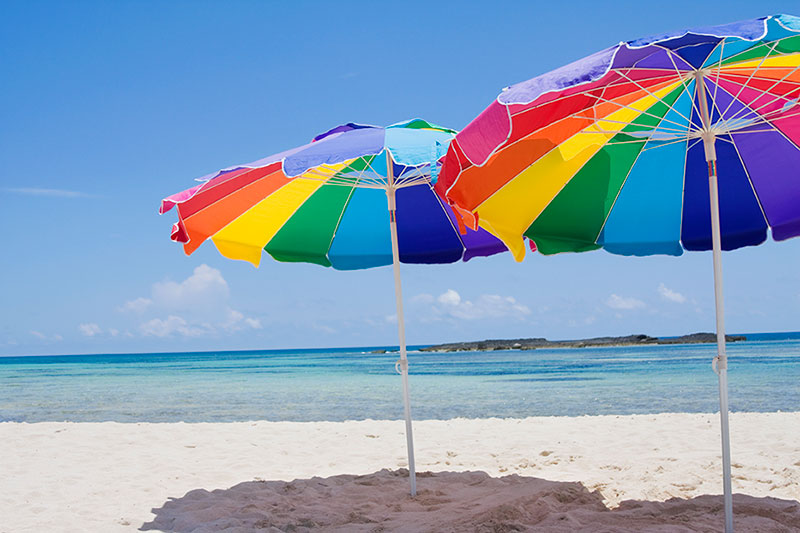 gay-travel-rainbow-umbrellas - Purple Light Vacations